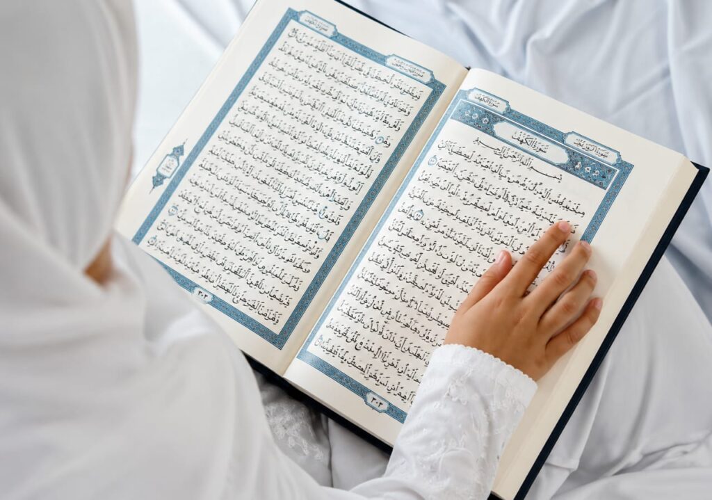 Child reading the Holy Quran with Tajweed
