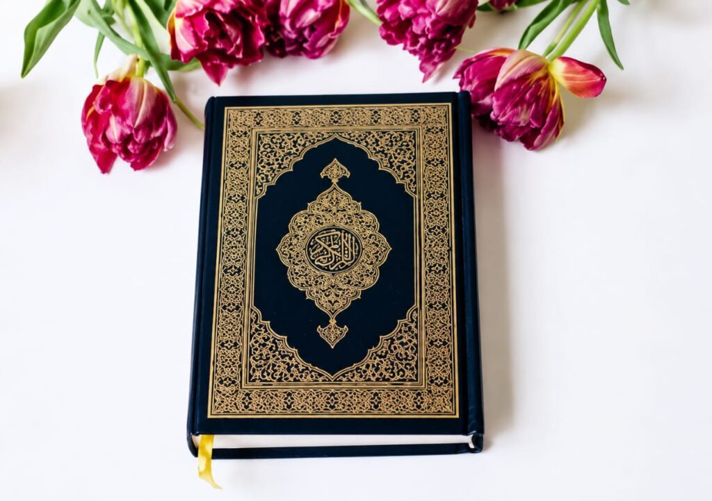 Holy Quran placed with beautiful flowers