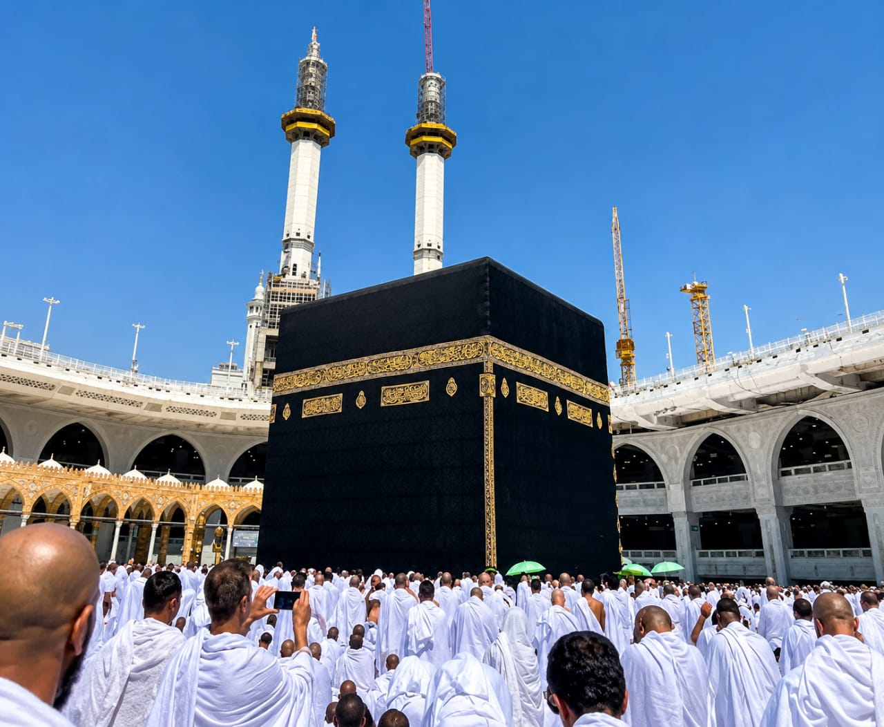 Holy Kaaba in Masjid al-Haram surrounded by pilgrims in Makkah, Saudi Arabia.